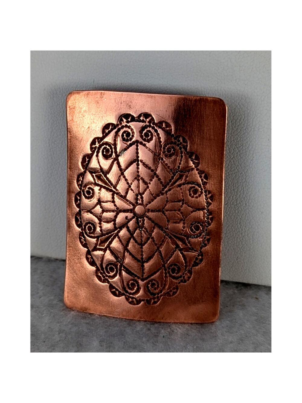 Copper etched pendant bail on back. Will accommodate a 1/4"Cord or chain NWT